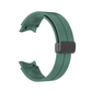 Olive green silicone strap for Samsung Galaxy Watch 4/5/6 with a matte black buckle and band loop, showcasing a smooth finish and a tapering design with holes for adjustable fit and comfort